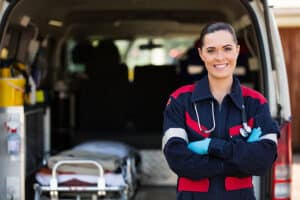 Florida EMS paramedic standing in front of an ambulance.