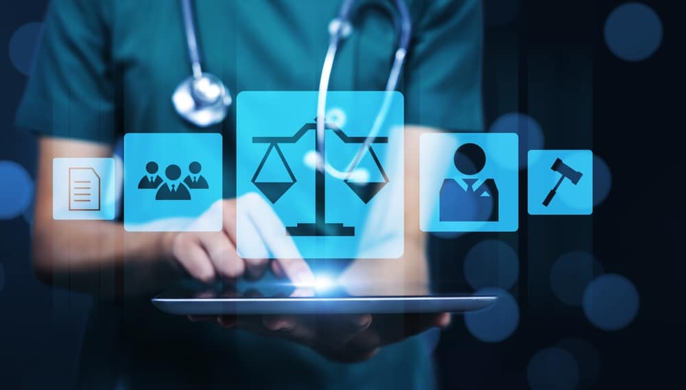 Female doctor holding tablet technology graphical