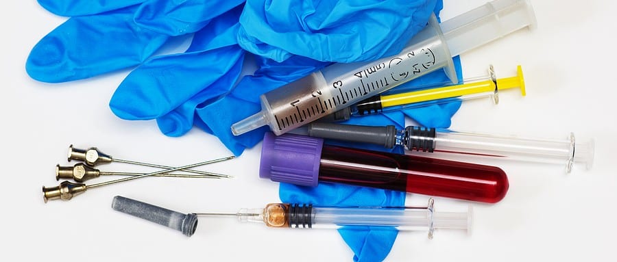 Medical waste with syringe and bio-hazard vial.